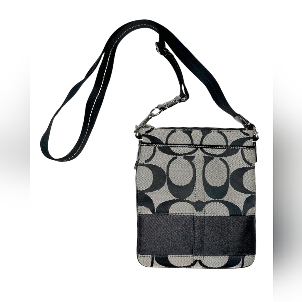 Coach crossbody purse with signature “C”print all over. Zipper closure.